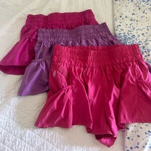 Free people get your flirt on shorts size large — set of 3 — purple + pink